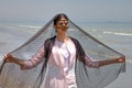 Bandari woman wears a traditional mask, coast of Persian Gulf.