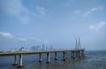 Bandra worli sea-link bridge in sea at Bandra, Mumbai with Mumbai's skyline behind it