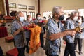 Bandung, Indonesia - January 8, 2022 : Buddhist People pray together with the monks while giving the offering in front of the