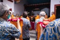 Bandung, Indonesia - January 8, 2022 : Buddhist People pray together with the monks while giving the offering in front of the