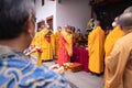 Bandung, Indonesia - January 8, 2022 : Buddhist People pray together with the monks while giving the offering in front of the