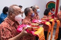 A Group of mature men presented the gift to all monks in the temple