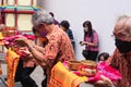 A Group of mature men presented the gift to all monks in the temple