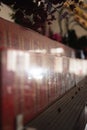 Bandung, Indonesia - January 8, 2022 : The offerings like food and candle on the top of the red Buddhist table during the praying