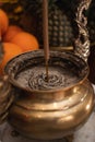 Bandung, Indonesia - January 8, 2022 : The offerings like food and candle on the top of the red Buddhist table during the praying