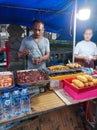 Bandung, Indonesia - January 1, 2024: Two street food vendors selling food in Badung, Bali, Indonesia