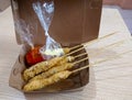 Bandung, Indonesia Ã¢â¬â July 27, 2021 :sate taichan egg rolls, chili sauce and salt. Royalty Free Stock Photo