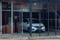 Car parked inside an iron cage garage.
