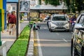 Road cleaners work on the side of the Alun-Alun street, Bandung. Royalty Free Stock Photo