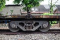 Rusty train bogie wheel set close up photo. Royalty Free Stock Photo