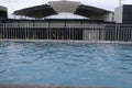 swimming pool with a beautiful building roof as a backdrop