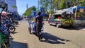 Photo of a man pushing a merchandise cart - stock photo