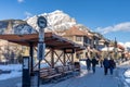 Street view of Town of Banff. Bus stop on Banff Avenue in winter snowy season.
