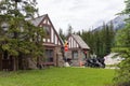 Motorcyclists wait in line to buy a Parks Canada pass for Banff National Park, off of the