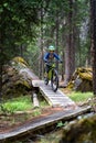 A young boy rides his mountain bike