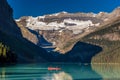 Banff, Canada - Ago 19th 2017 - Tourists doing kayak and enjoying the amazing scenario of lake Moraine, early morning light, glaci