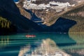 Banff, Canada - Ago 19th 2017 - Tourists doing kayak and enjoying the amazing scenario of lake Moraine, early morning light, glaci