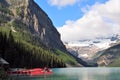 Banff National Park  Lake Louise glacial lake with red canoes Royalty Free Stock Photo