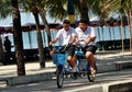 Bang Saen,Thailand: Students Riding Bicycle-Built-for-Two Royalty Free Stock Photo