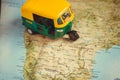 Bangalore city and other on India roads map with driving toy model of auto-rickshaw vehicle Royalty Free Stock Photo