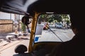 Bangalore, India - June 08, 2020. Rickshaw driving through streets of Bengaluru India. Driver taxi and citizens in face