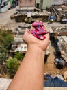 Stock photo of an girl`s hand, holding boomer chewing gum or Indian chewing gum under bright