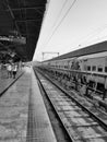 Closeup of Yesvantpur Junction railway station inside view of station corridor, escalator, pedestrian path, trains in a platform