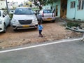 Indian Blue Shirt Wear little Kid in a Big Bazaar Sitting in a Trolley with Cap