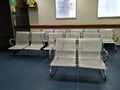 Closeup of Empty Steel Chairs at the Entrance or Opposite of Reception of Fortis Hospital, Rajajinagar. Hospital waiting room with