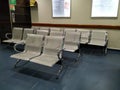 Closeup of Empty Steel Chairs at the Entrance or Opposite of Reception of Fortis Hospital, Rajajinagar. Hospital waiting room with