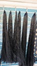 Bangalore,Karnataka,India-January 01 2023: Womens black hair wig on sale in Shivaji nagar