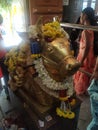 Closeup of Shiva Linga and his vehicle Nandi decoration by colorful flowers during Maha Shivaratri festival at Nanjundeshwara