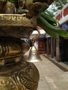 Closeup of Small Traditional Metal Bronze or Brass Bell Hang to Dwaja Stambha in front of Kadu Malleshwara Lord Shiva Temple