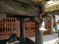 Closeup of Small Traditional Metal Bronze or Brass Bell Hang to Dwaja Stambha in front of Kadu Malleshwara Lord Shiva Temple Royalty Free Stock Photo