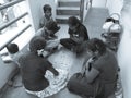 Group of Indian Kids Playing Chowka bhara or Ludo Board Game in Royalty Free Stock Photo