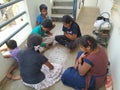 Group of Indian Kids Playing Chowka bhara or Ludo Board Game in front of the House Royalty Free Stock Photo