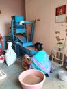 Indian Traditional Lady Filling Cleaned Ragi from Automatic Cleaning Machine