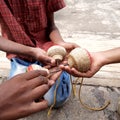 Closeup of different age group and sex kids playing Buguri or Spinning Tops on Roadside during holiday