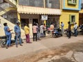 Closeup of group of peoples standing in a queue to take Covid 19 Vaccination free at the Primary Health Centre Rajagopala Nagar