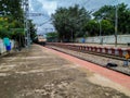 Closeup of Lottegollahalli Railway Station with Yellow and black Color Name Board