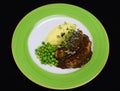 Banger and mash with onion gravy and green peas