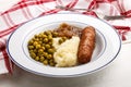 Banger and mash potato with cooked pea Royalty Free Stock Photo