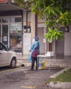 Health worker performing COVID-19 sampling taken from individuals by drive thru at the Quick Test Kit Program from a local clinic