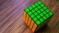 5x5 Rubik's Cube on a wooden table background Royalty Free Stock Photo