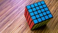 5x5 Rubik's Cube on a wooden table background. Royalty Free Stock Photo