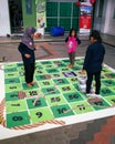 Children are playing the gigantic rope game or dam tali in Malay language