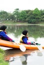 Women kayaking in the Taman Tasik Cempaka lake in the morning Royalty Free Stock Photo