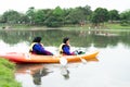 Women kayaking in the Taman Tasik Cempaka lake in the morning