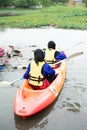 Women kayaking in the Taman Tasik Cempaka lake in the morning