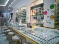 Exhibitor of glasses consisting of shelves of fashionable glasses shown at the optical shop